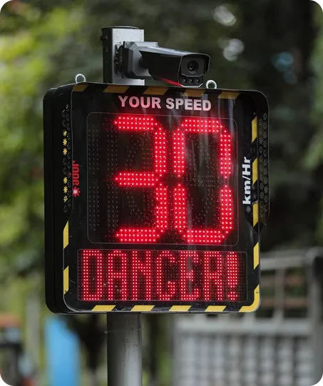 Ador speed display with an integrated enforcement camera flagging a speeding vehicle