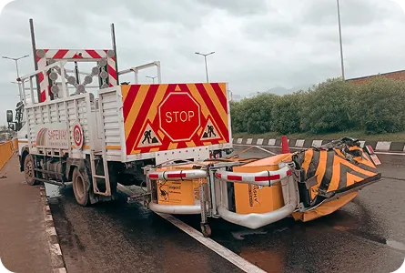 Truck mounted attenuator with arrow board protecting a road crew in a live lane