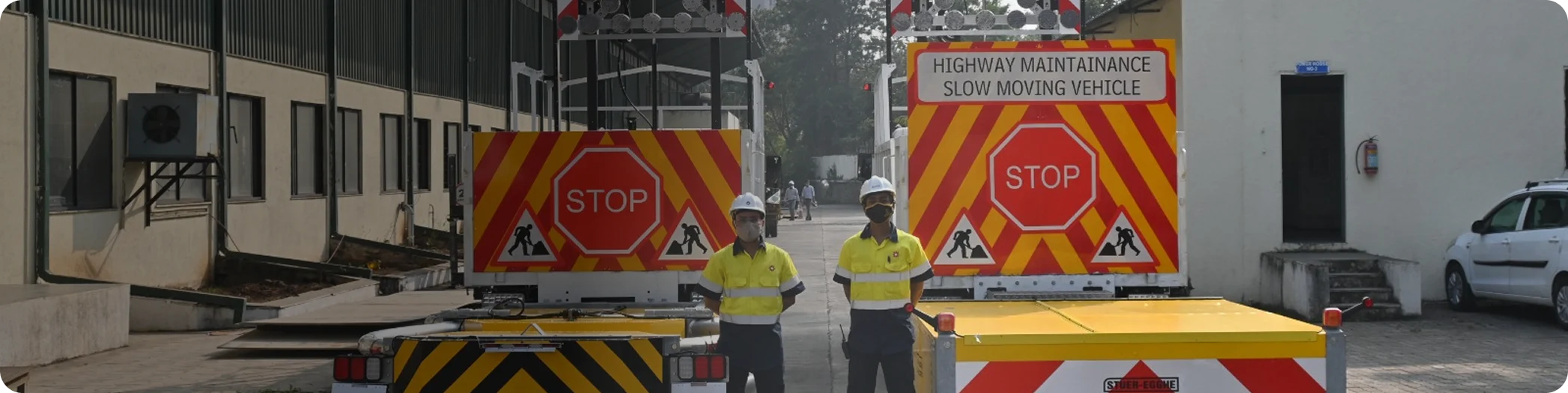 Ador truck-mounted attenuators deployed with road workers behind highway maintenance vehicles